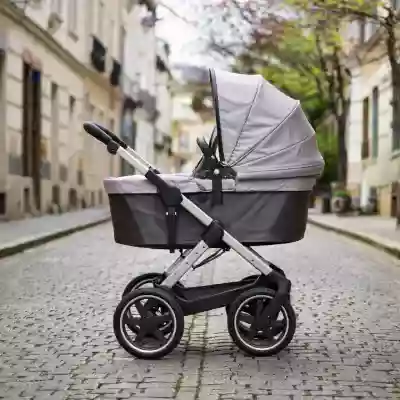 Parent pushing a baby stroller