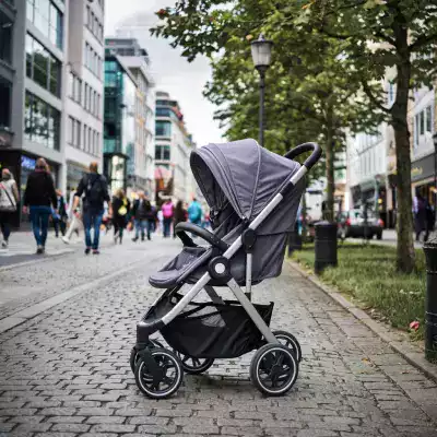 Happy child in a rented stroller